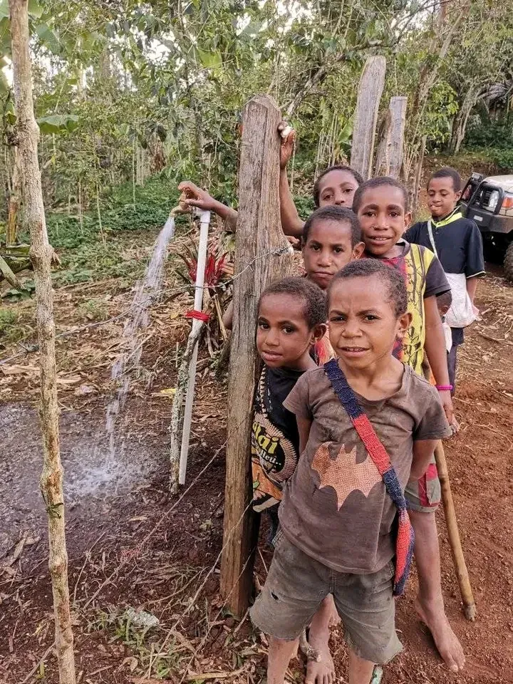 Children beside a new tapstand in the Papua New Guinea highlands